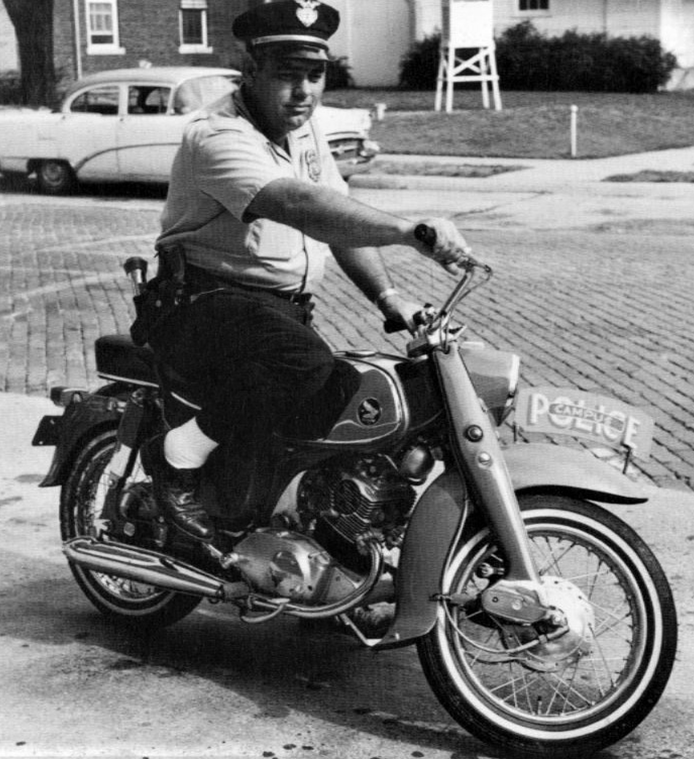 Campus police officer on new motorcycle in 1965.