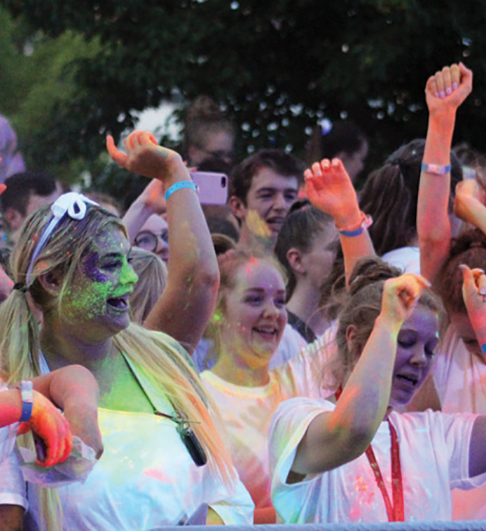 Students celebrating the beginning of the school year at the Foam and Powder Paint Party.